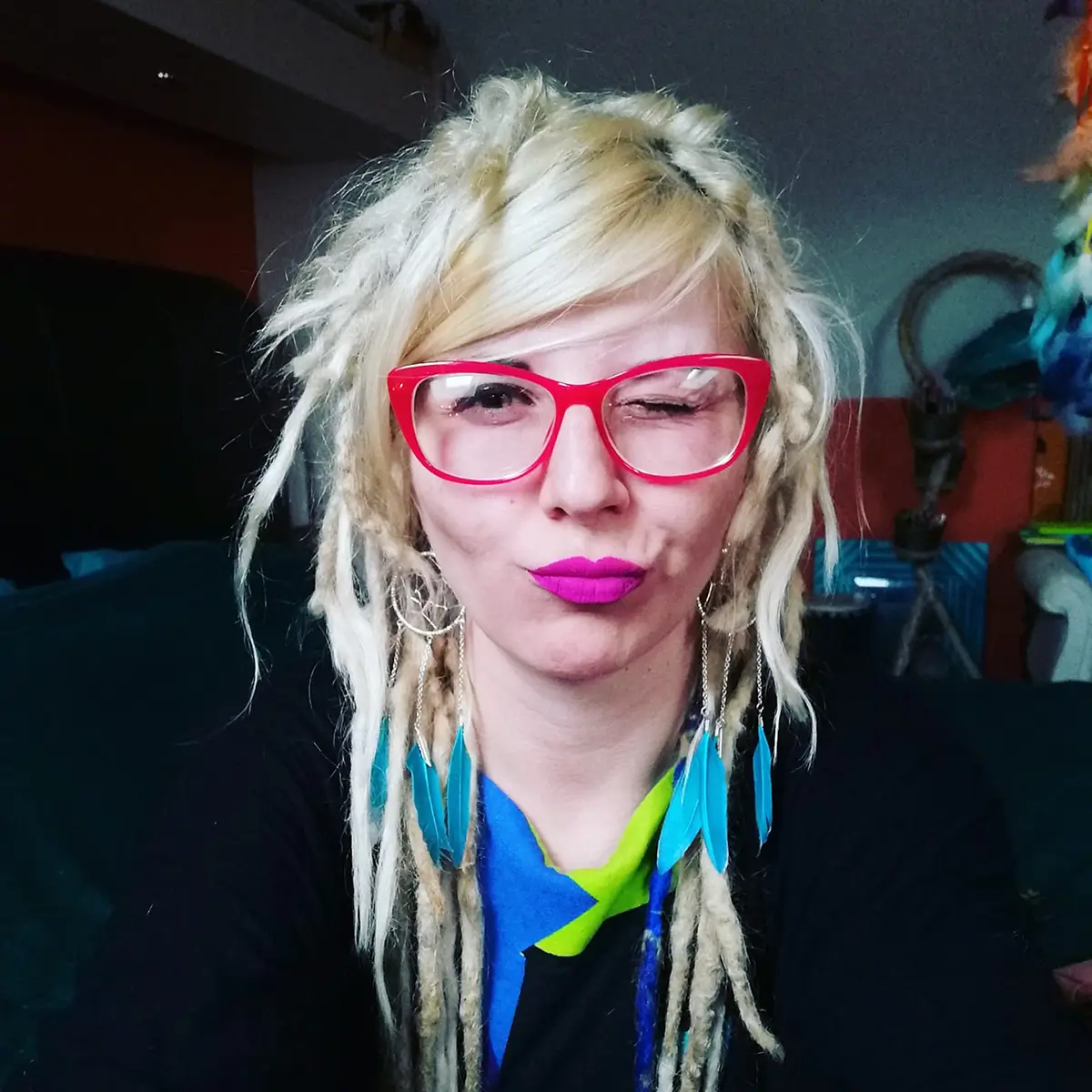 Ewelina Wu portrait with dreads and magenta lipstick